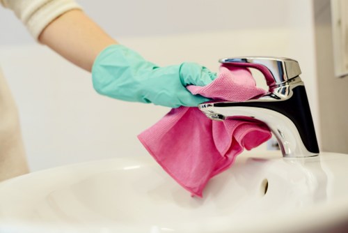 Cleaner preparing safety equipment before a cleaning job